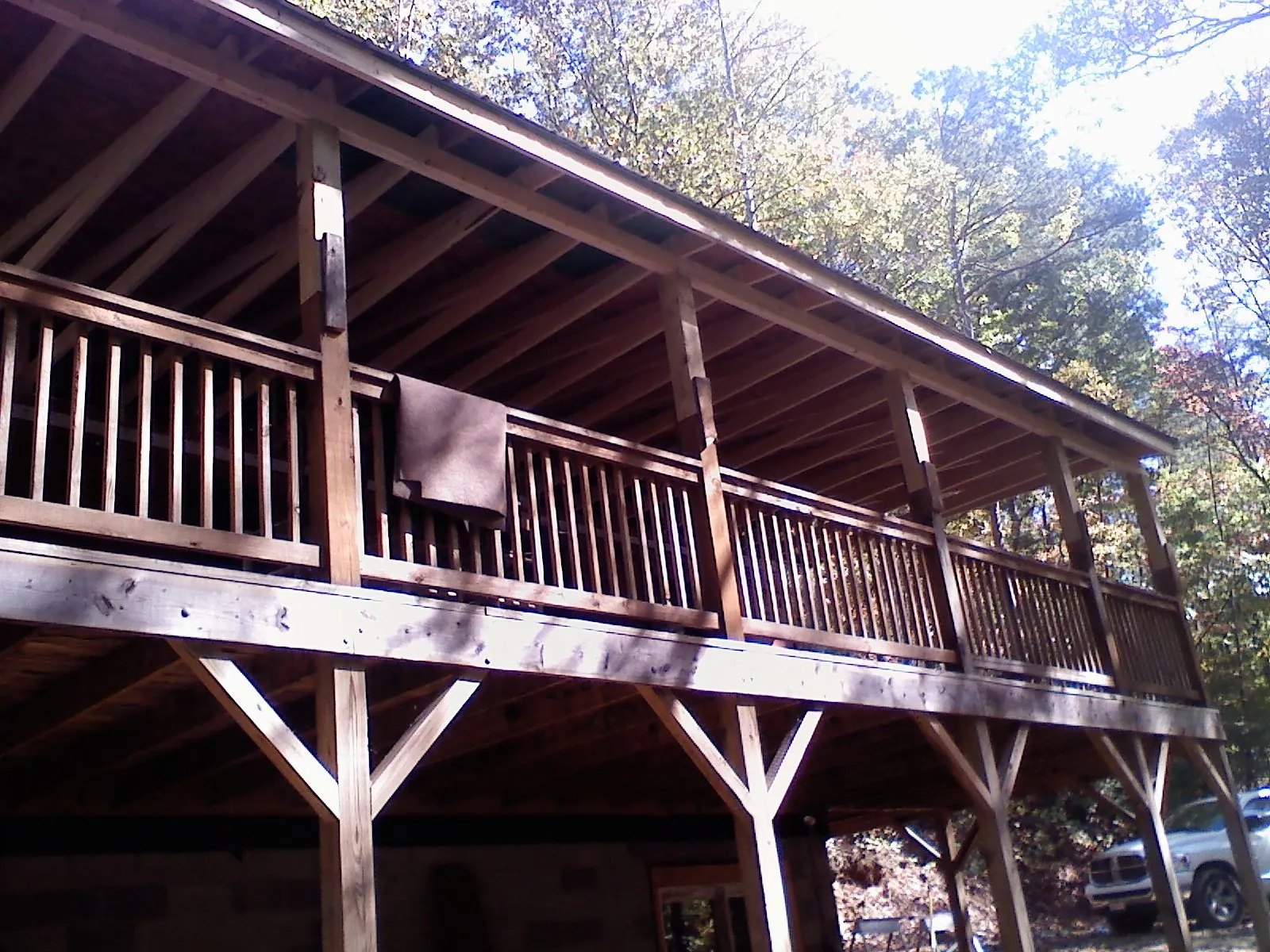 Timber framing under a new elevated porch and deck — Roof Leak Repair in South Kent by Roofing Brothers